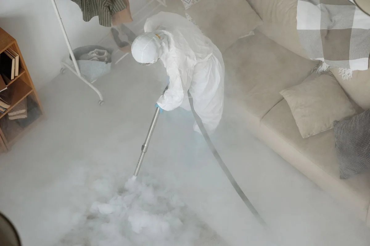 Biohazard cleanup technician in protective equipment, Cedar Bluff, VA